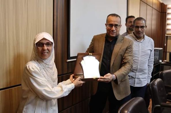 The Dean of the College of Medicine honors Ms. Mona Youssef Kamel, employee of Student Affairs, for reaching retirement age.