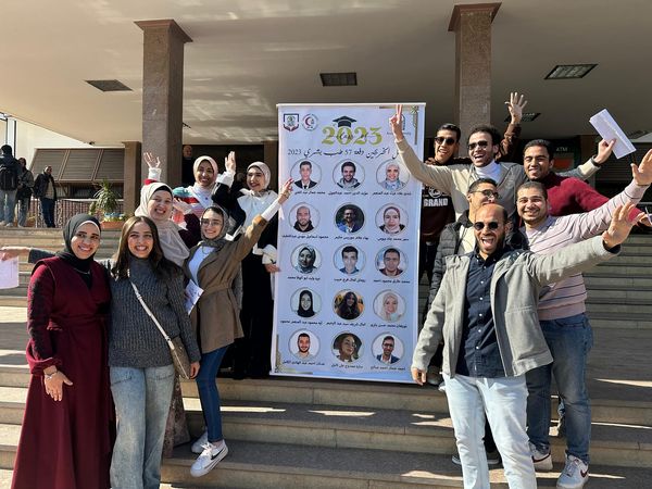 Souvenir photos of the first graduates of the 57th batch of medicine, Assiut, in front of the Faculty of Medicine, after the prosecutors were selected.